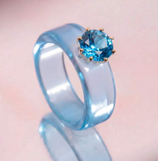 Anillo CG de topacio Swiss Blue y resina celeste
