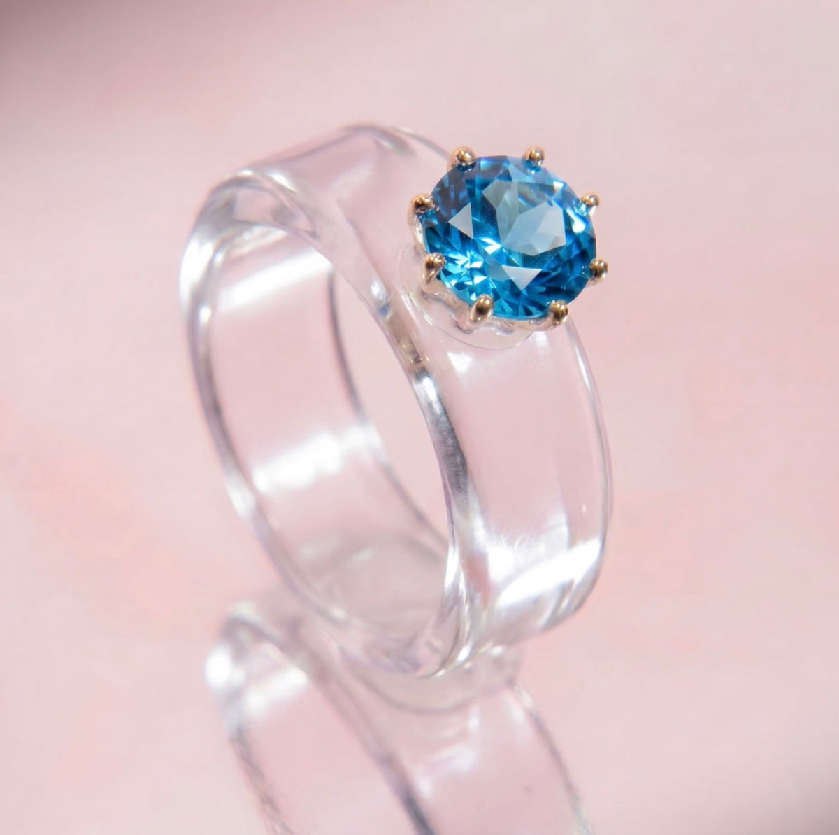 Anillo CG de topacio Swiss Blue y resina transparente